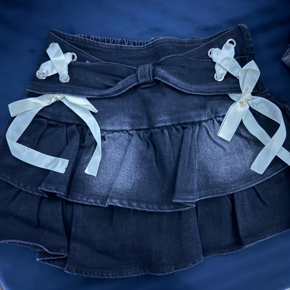 Elegant Black Ruffled Skirt with Cream Bows